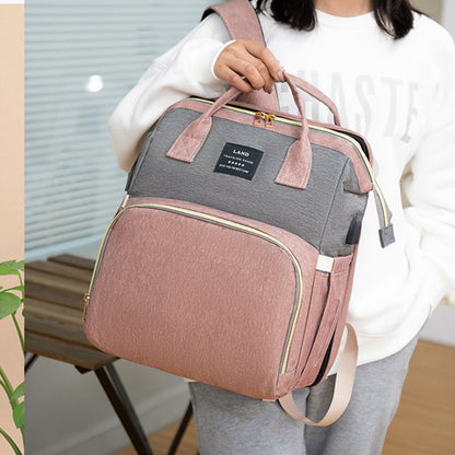 Dream Voyager - Zaino Fasciatoio 2-in-1 con Culla Integrata e Porta USB